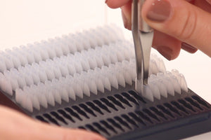 Single-handed tool for upper eyelid eversion and lower eyelid eversion to simplify taking images with a meibographer.  Easy load package to add a new pair of single use disposable tips for each patient.